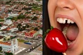Mulher quebra dente ao morder “morango do amor” e dentistas fazem alerta sobre o risco do doce viral