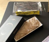 Mulher compra Iphone em site de loja e recebe saco de areia