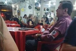 Homem que exibiu símbolo nazista em bar de MG será investigado