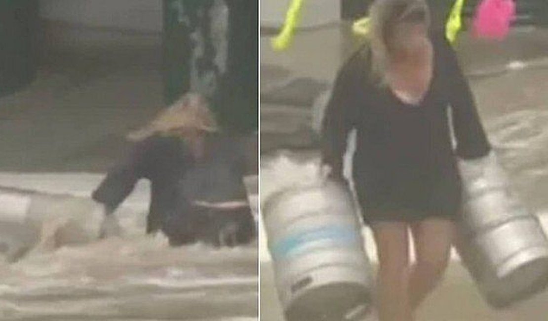 Mulher pula no mar para salvar barris de cerveja arrastados durante tempestade; assista