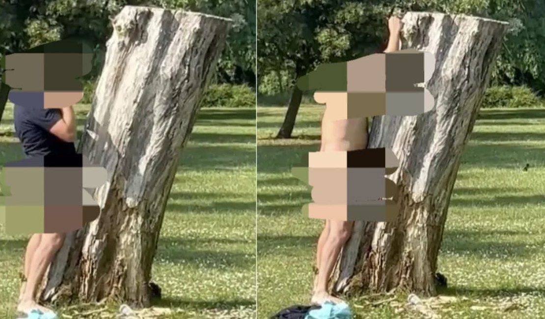 Homem faz 'sexo' com tronco em parque sem se incomodar com os olhares das pessoas