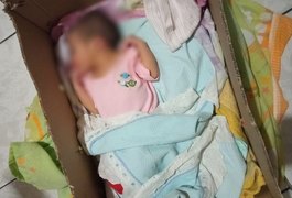 Recém-nascida ainda com cordão umbilical é encontrada dentro de caixa, em cesto de lixo